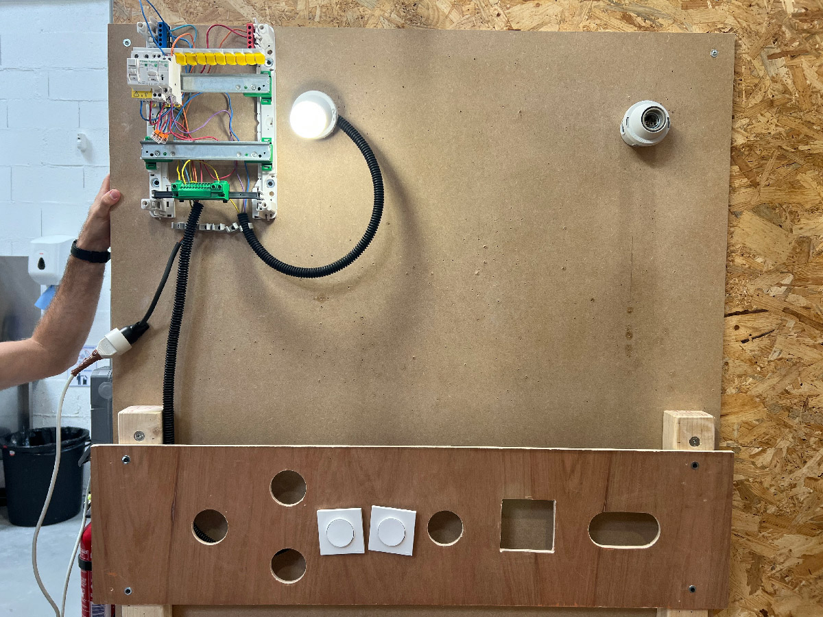 Installation of a latching switch with two push-buttons.