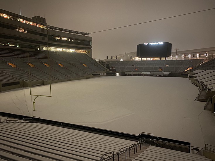 Woke up at 4 AM and snuck into a football stadium in the fresh snow