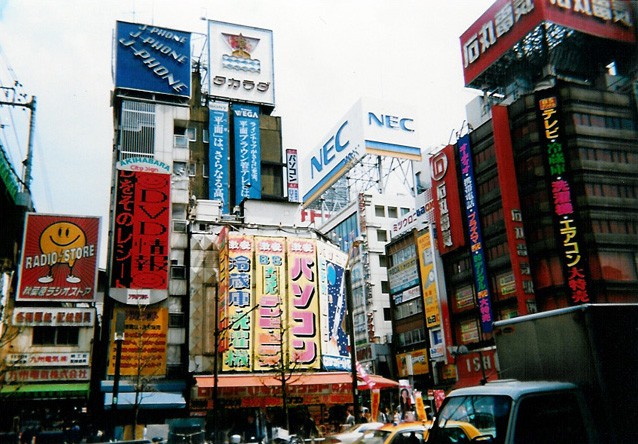 Akihabara old-school billboards stacking brand on brand