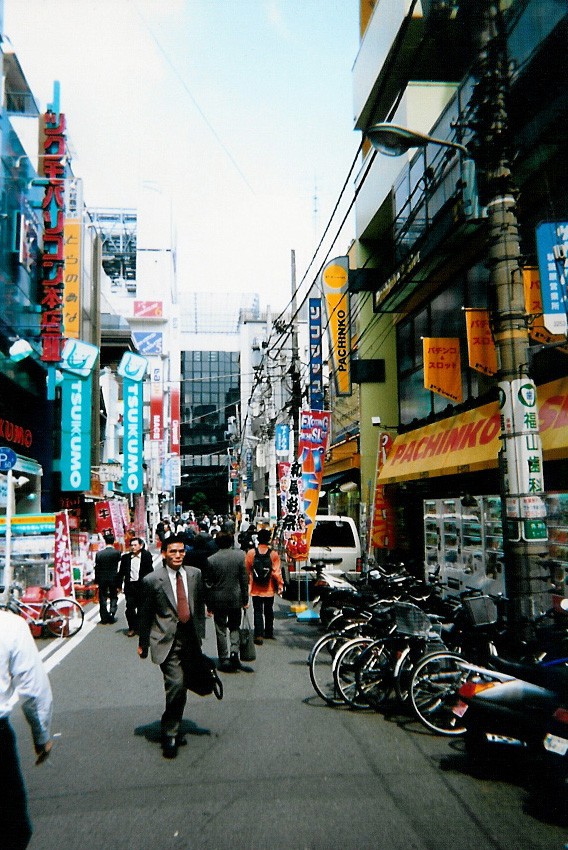 Akihabara back-street with a salaryman in a rush