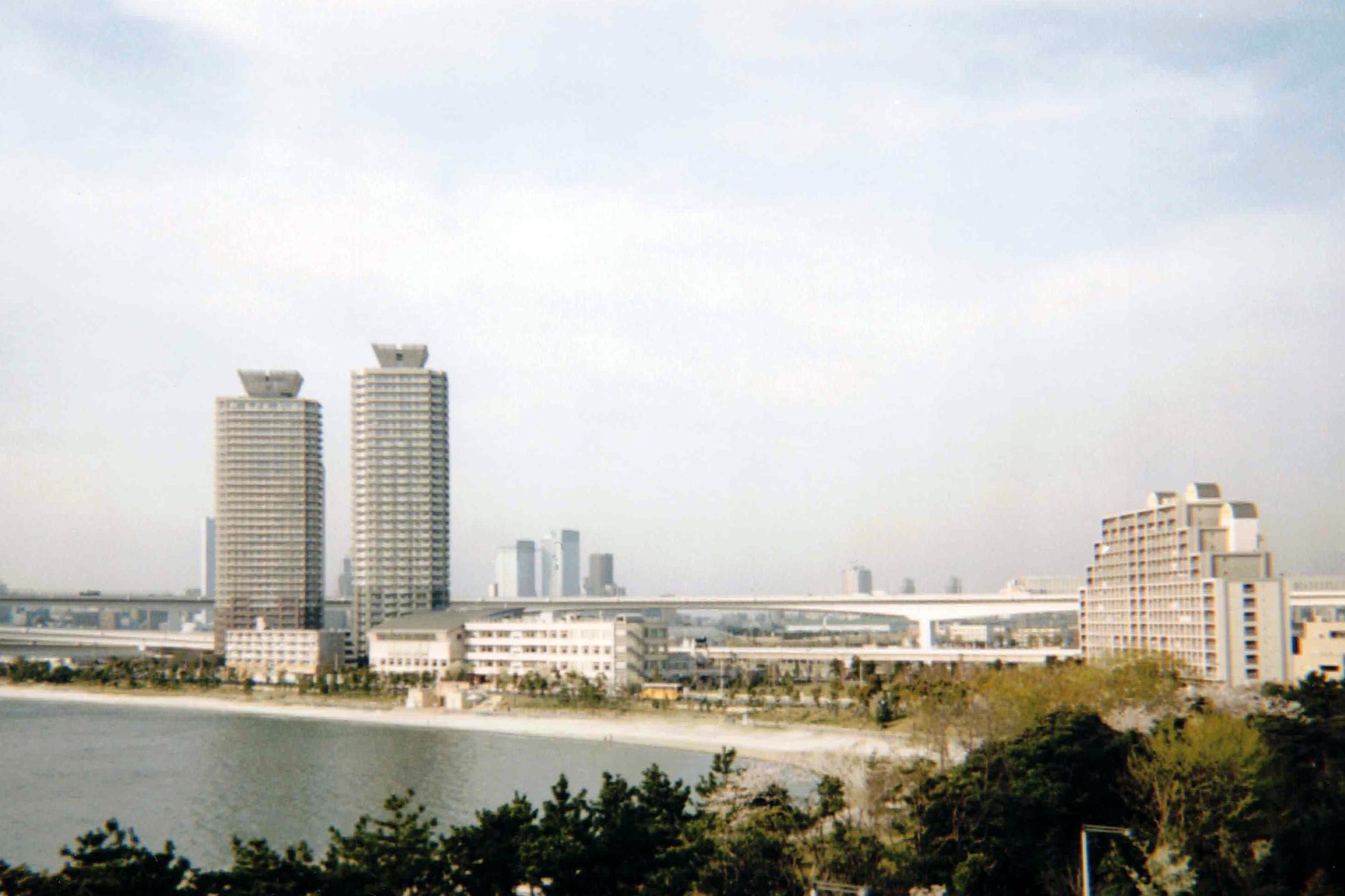 From Odaiba Beach. Rainbow Bridge arcs across the bay, linking the artificial island to mainland Tokyo
