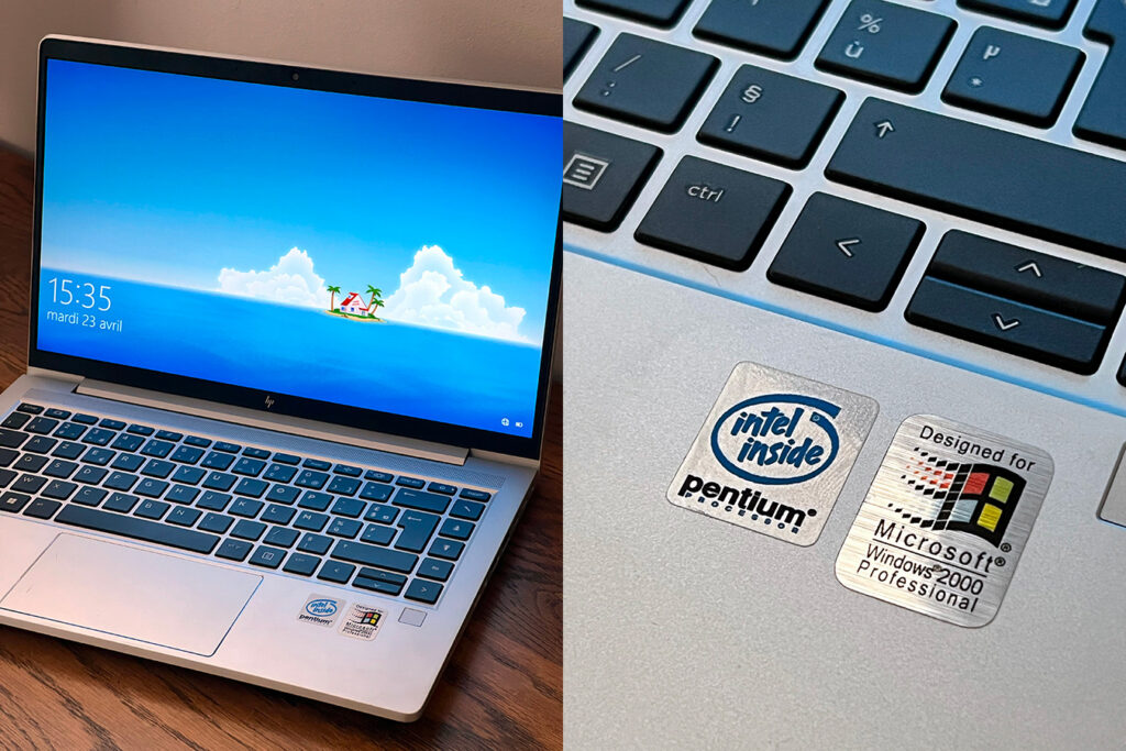 A modern computer with two retro stickers.