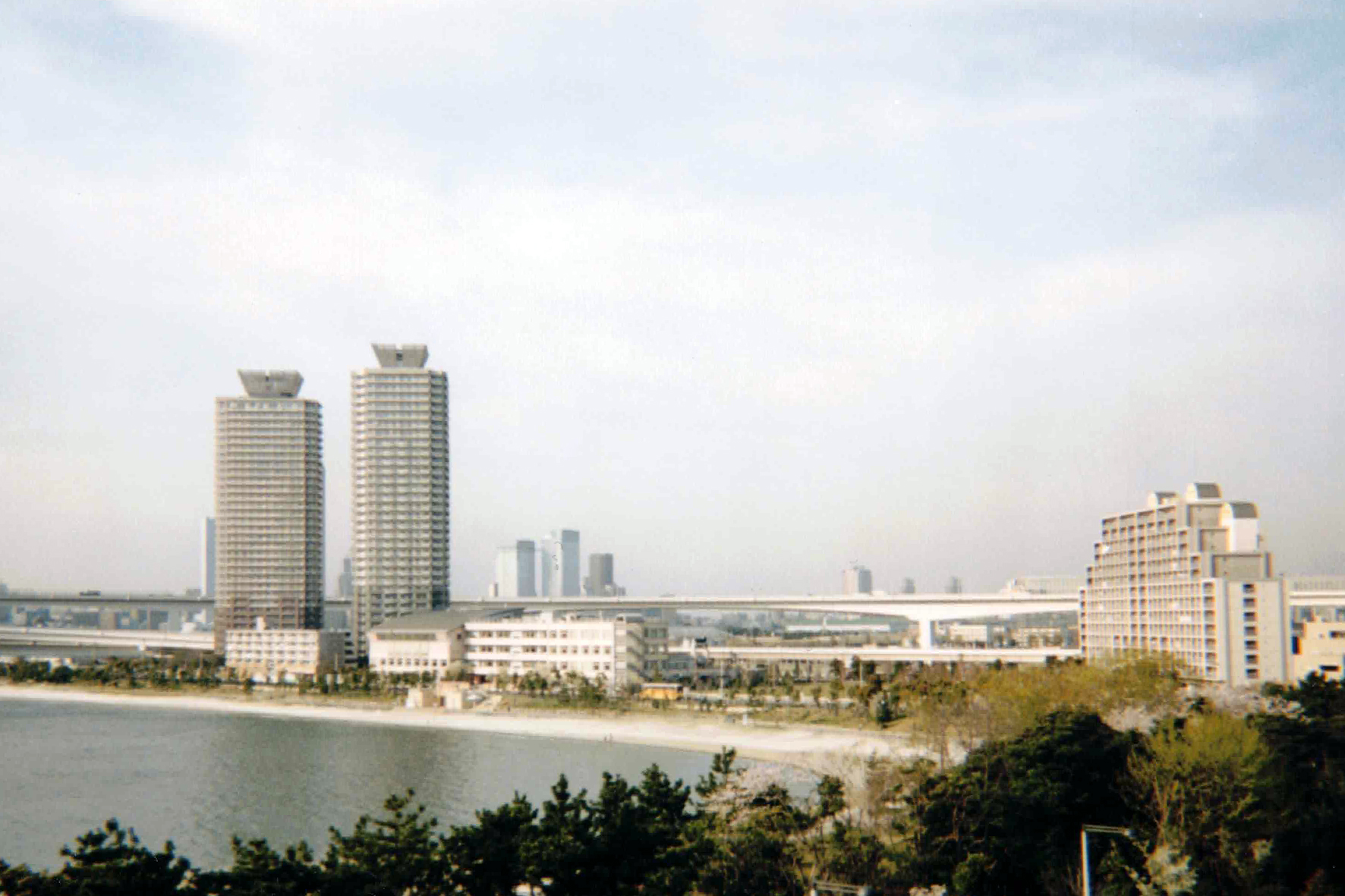 From Odaiba Beach. Rainbow Bridge arcs across the bay, linking the artificial island to mainland Tokyo.